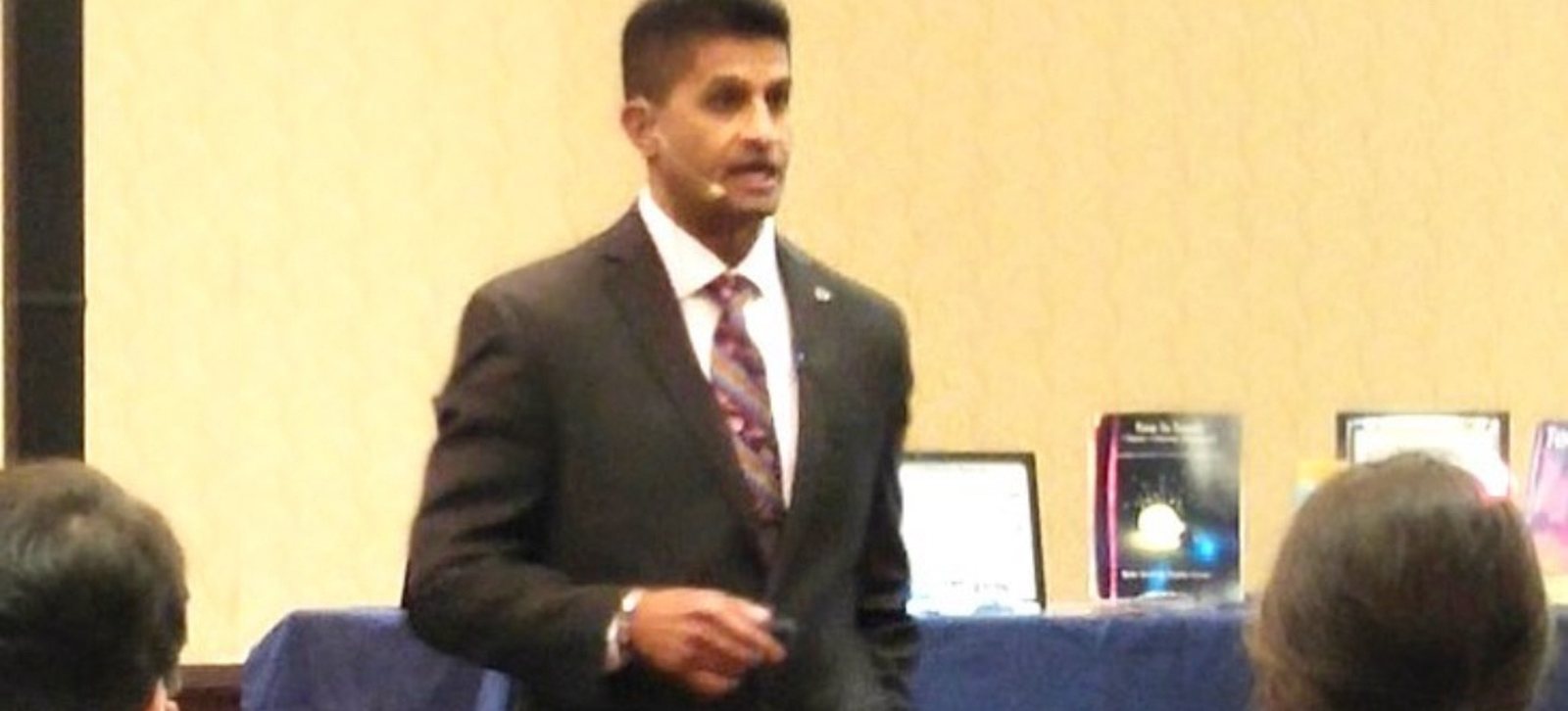 Dr. Johnny Alvarado presenting at a training