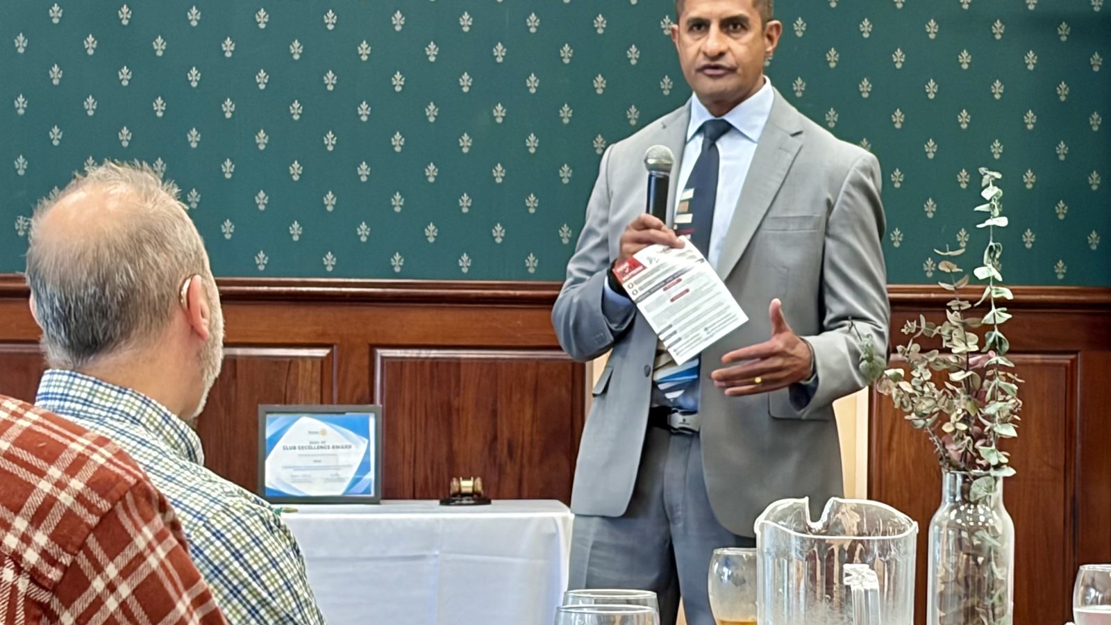 Dr. Johnny Alvarado speaking to a room